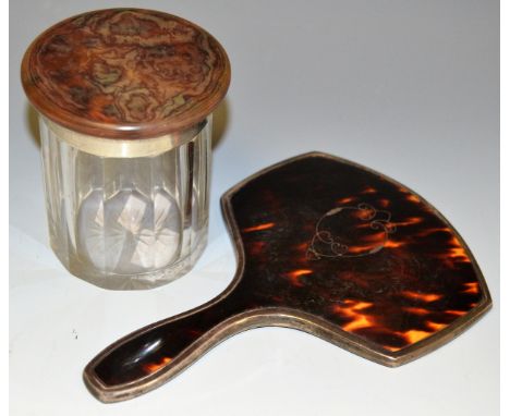 A tortoise shell and silver hand mirror, Mappin and Webb, London 1928; an Art Deco cut glass jar with silver and tortoise she