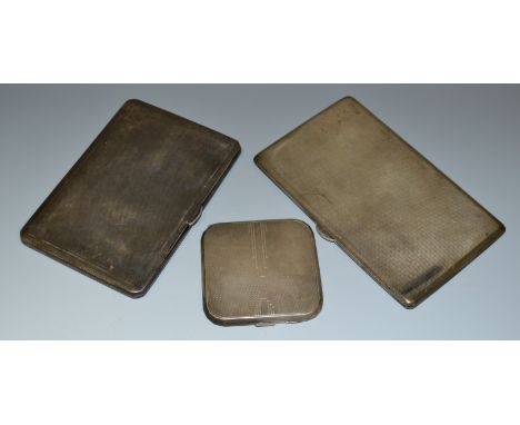 A silver cigarette case by Dudley Russell Howitt, Birmingham, 1941, engine turned; another similar, Walker & Hall, Sheffield,