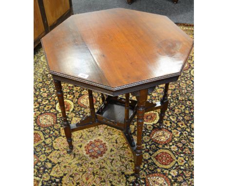 A Victorian mahogany octagonal table, turned legs, shelf stretcher, casters, 63cm wide, 72cm high, c.1870