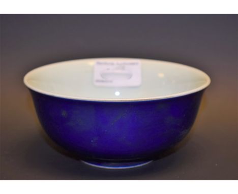 A blue porcelain bowl, light blue interior, character marks to base, 13cm diameter