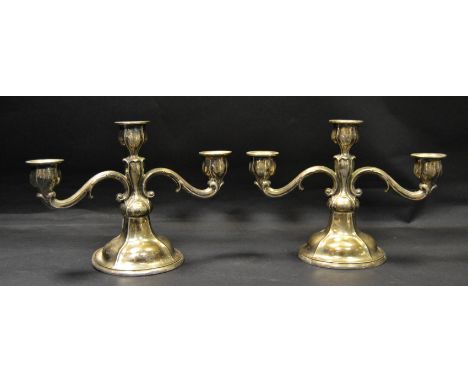 A pair of 830S, silver two branch table candlesticks, plated bases