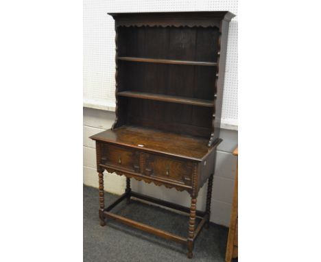 An early mid 20th Century block fronted dresser, bobbin turned supports