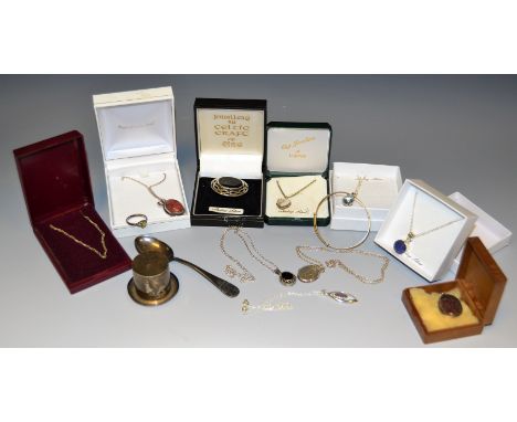A silver trinket pot in the form of a top hat; silver Celtic brooches, marked sterling; semi precious inset pendants; etc 