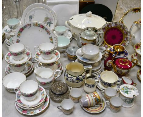 A silver topped dressing table jar; an English bone china tea service for six, printed with summer flowers; another English t