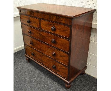 A Victorian flame mahogany chest, two hidden drawers over two short cockbeaded drawers over three graduated long, button hand