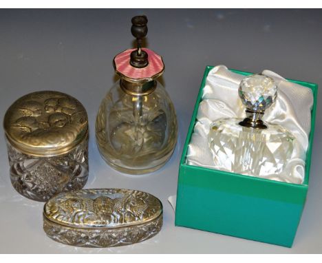 Two dressing table jars with silver tops embossed with Reynolds angels, Birmingham 1907 and 1908; a cut glass atomiser, white