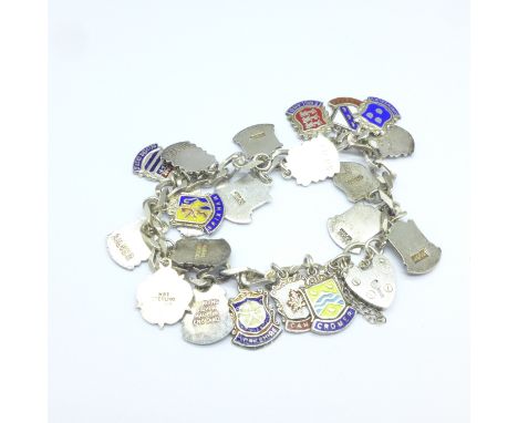 A silver and enamel charm bracelet, 42g