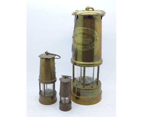 A miner's lamp and two small miner's lamps