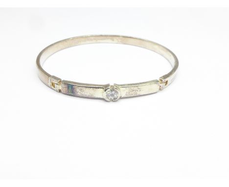 A white metal bangle (tests as silver), marked 925