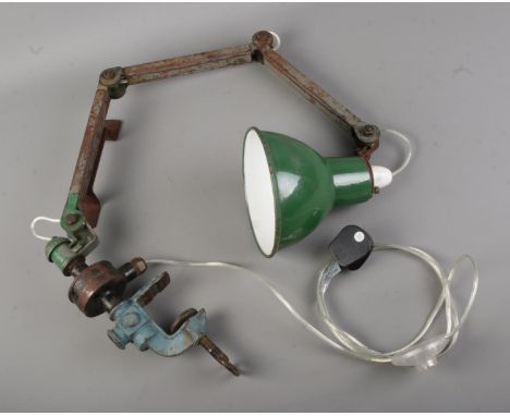 An industrial factory desk-top machinist's anglepoise lamp with enamel green shade