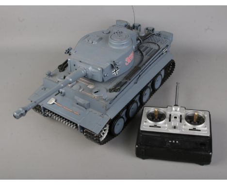 A 1/16th scale remote control battle tank: German Tiger I 3818 featuring BB pellet firing. Includes Sender remote control.  T