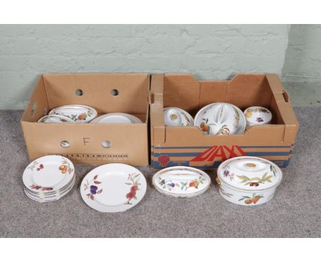 A collection of vintage Royal Worcester "Evesham" dinnerware, including tureens, plates and various other pieces, totally twe