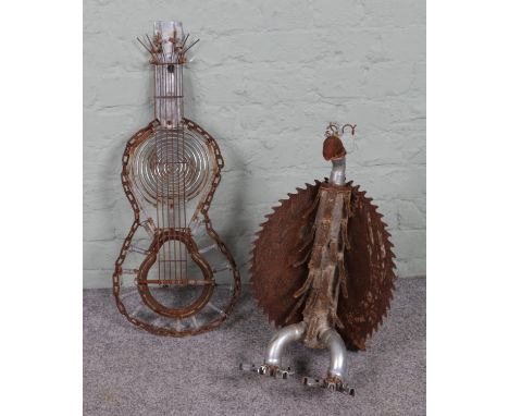 Two architectural salvage sculptures formed as a chicken and guitar constructed using various scrap metal parts.