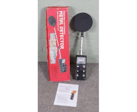 A vintage Micronta boxed metal detector, comes with batteries and manual, featuring Deluxe Very Low Frequency, functional.