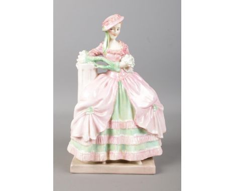 An early Royal Doulton ceramic figurine 'Kate Hardcastle' HN 1718, produced between 1935 - 1949, designed by Leslie Harradine