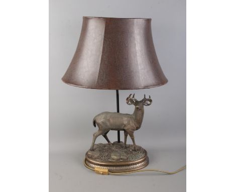 A vintage Stag table lamp, with leather effect shade, bronze style finish with carved details.  Good condition, in working or