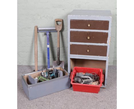 A pine chest of drawers holding a large quantity of tools including router, angle grinder, small circular saw, g clamps, Stan