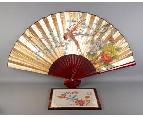 A large vintage Chinese hand-painted paper fan and a vintage framed Chinese silk painting, both depicting exotic birds among 