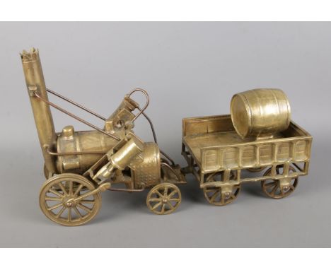 Stephenson's Rocket steam locomotive, brass model of a steam engine with carriage and barrel.  Total length 38cm, engine leng