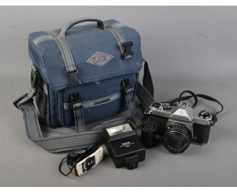 An Asahi Pentax K1000 vintage film SLR camera with associated lens, Vivitar 1900 electronic flash gun, bag and other accessor