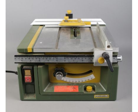 A Proxxon LU-6868 bench top circular saw, with attachment.