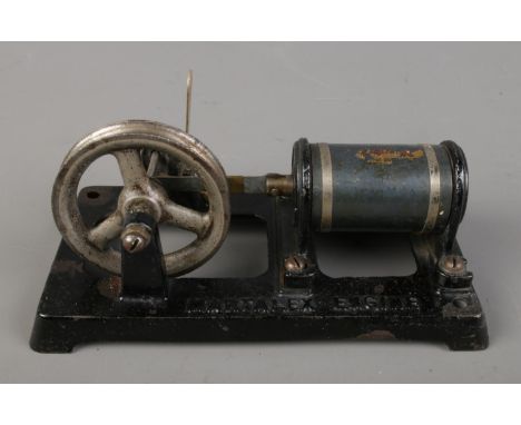 An antique Martalex electro magnetic piston toy engine. Approx. length 16.5cm.