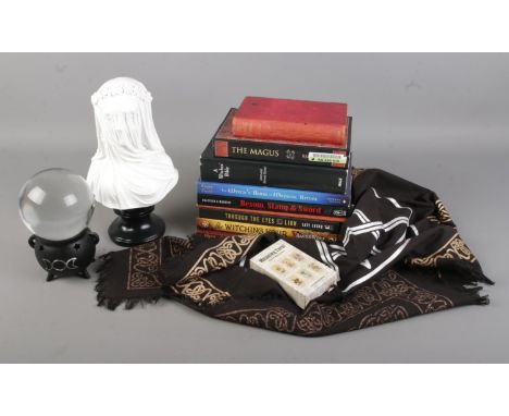 A collection of books surrounding the topics of magic, mysticism and religion including 'A Witches Bible' 'The Witching Hour'