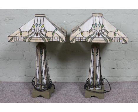 A pair of vintage Tiffany style lamps, produced by Kind Light Manufactory in 2008, twin bulbs to the top and heavy metal base