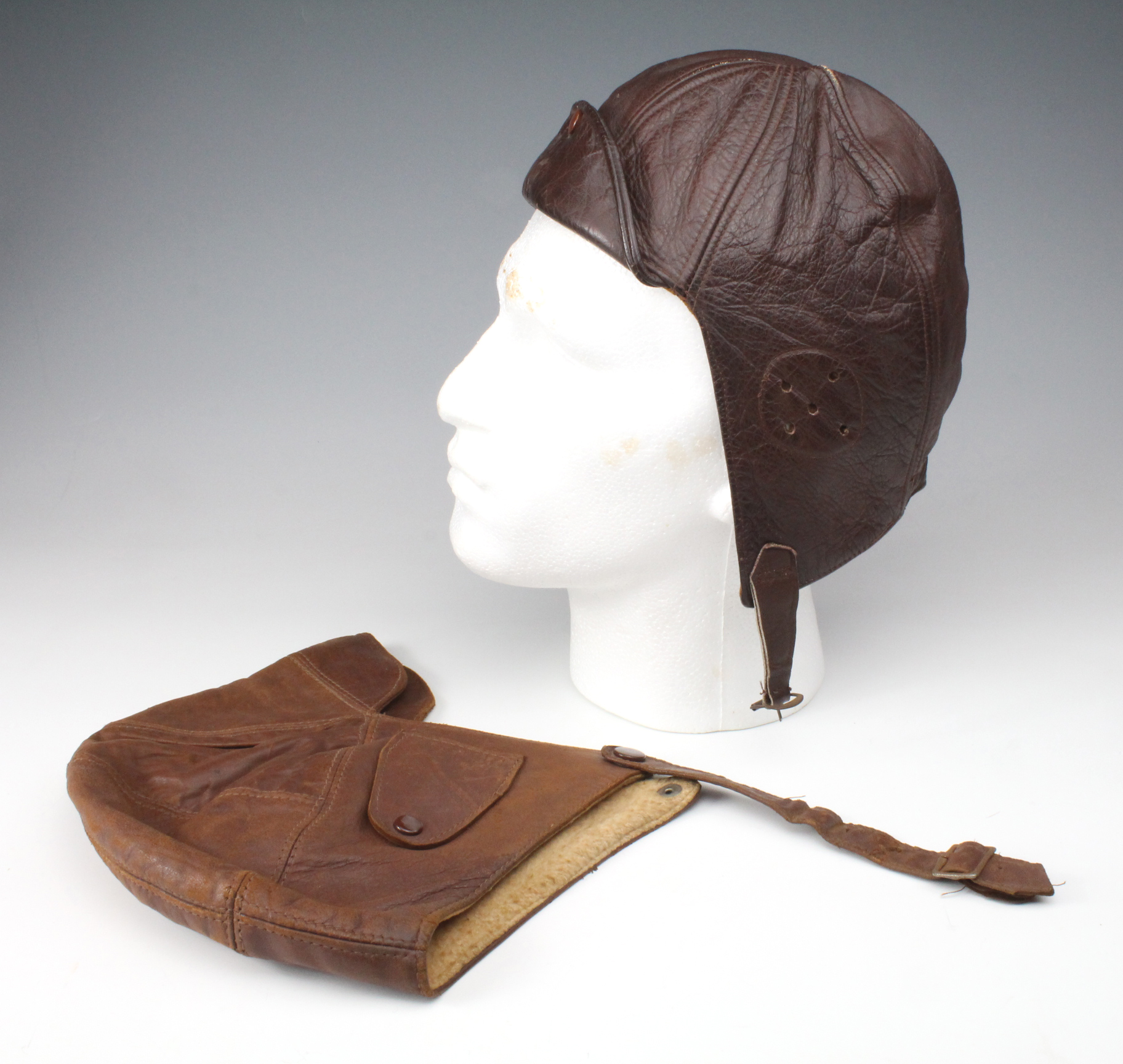 Two leather motoring / motorcycle helmets, circa mid 1920s