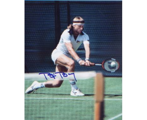Bjorn Borg signed 10 x 8 inch picture playing tennis at Wimbledon. Excellent. 