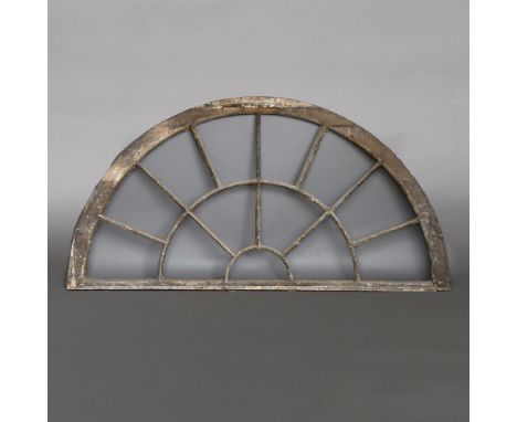 A GEORGIAN CAST IRON FAN LIGHT WINDOW. unglazed, height 83cm, width 155cm Location: - Hertfordshire (AL4)