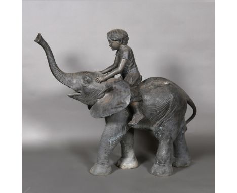 A BRONZE ELEPHANT WATER FEATURE. mid to late 20th century, in the form of a boy riding an elephant, the trunk as the water sp