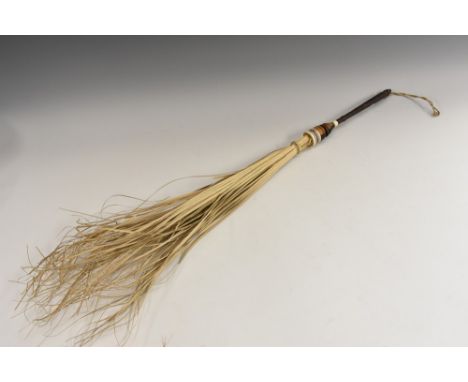 A Colonial fly whisk, turned hardwood haft, 69cm long overall, early 20th century; a North African dagger, 27.5cm curved blad