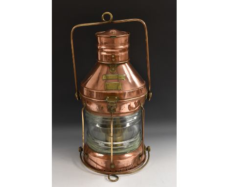 An early 20th century copper ship's lantern, by Meteorite, signal red, number 30041, the interior with oil burner, reservoir 