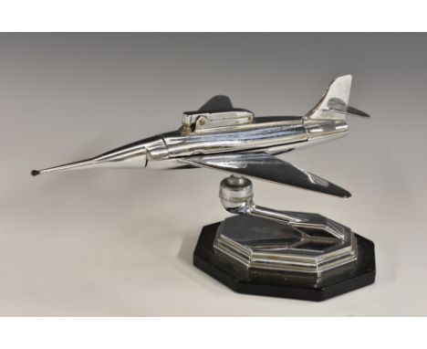 Aeronautica - a mid-20th century novelty table cigarette lighter, as a jet, canted rectangular base, registered design and pa