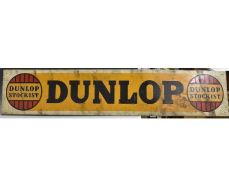 Advertising - Automobilia - a rectangular tin sign, Dunlop Stockist, printed in tones of yellow, black and red, marked BG, MS