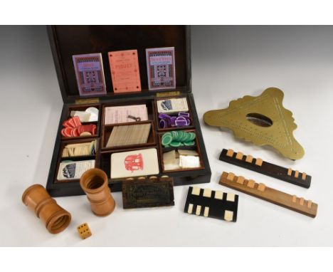A 19th century French rosewood rectangular games box, hinged cover enclosing an arrangement of playing cards, markers and Chi