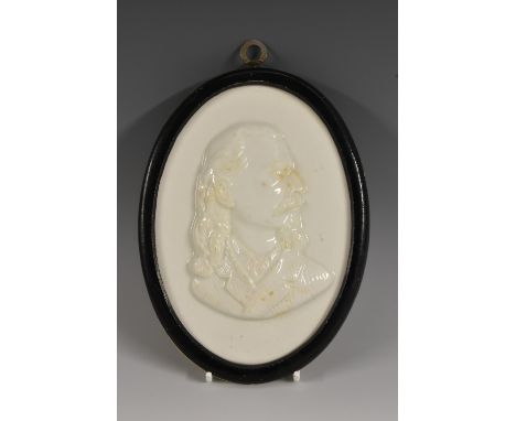 The American West - a ceramic portrait plaque, depicting William Frederick 'Buffalo Bill' Cody (1846 - 1917), bust length, ov