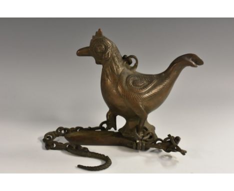 A late 19th century Indian hanging butter lamp, cast as a bird, 14cm high 