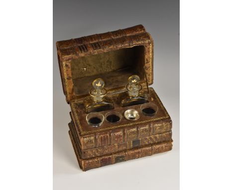 A 19th century bibliophillic tromp l'oeil decanter box, disguised as a stack of tooled and gilt leather bound books, hinged c