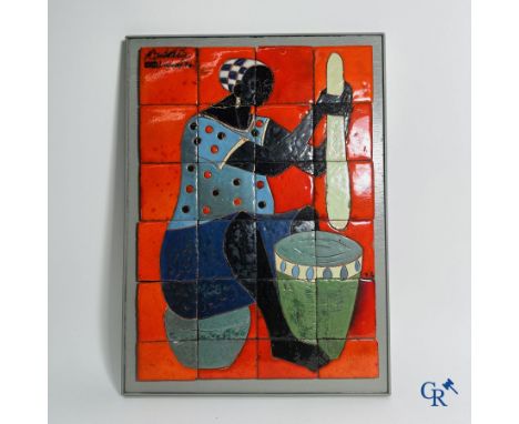 Tile panel depicting an African lady, 1960-1970. Signed illegibly. | 51 x 37 cm.