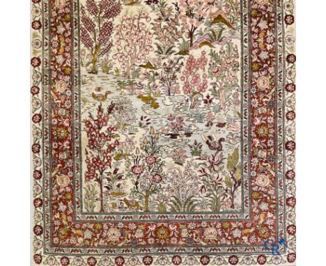 Oriental carpets: A finely hand-knotted silk carpet with water birds in a landscape on a floral background. | 154 x 90 cm. | 