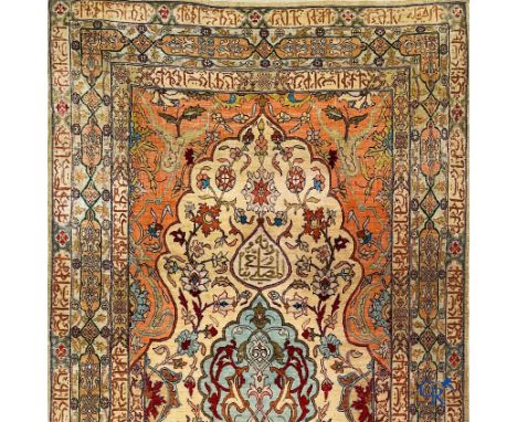 Oriental carpets, Hereke Turkey, a finely hand-knotted silk carpet with inscriptions and gold thread. | 128 x 78 cm. | Condit