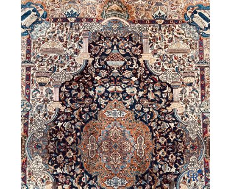 Oriental carpets: A large hand-knotted oriental carpet with antique decor, and images of birds and flowers. Multiple inscript