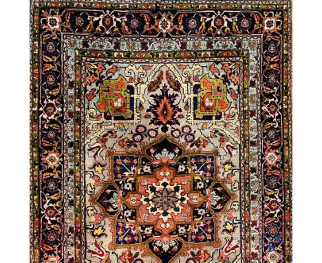 Oriental carpets: Heriz, an exceptionally finely knotted carpet decorated with silver thread. | 163 x 108 cm.
