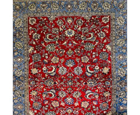 Oriental carpets: Iran, finely hand-knotted Persian carpet with a floral decor on a red and blue background. | 198 x 144 cm.