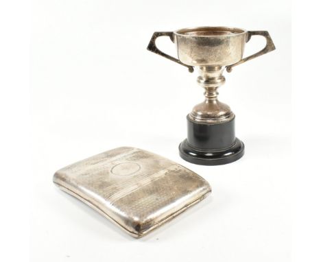 A George V hallmarked silver cigarette case and later trophy. The lot to include a n early 20th century cigarette case having