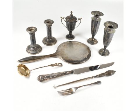 A collection of early 20th century hallmarked silver items. The lot to include an Edward VII pair of weighted posey vases. Ha