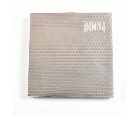 A George VI hallmarked silver compact. The make up powder compact having an engine turned repeated pattern with monogrammed c