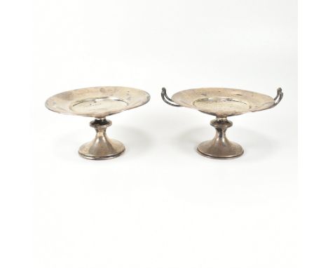 A pair of Edward VII hallmarked silver compote dishes. One having twin handles and both inscribed to centre with monogrammed 